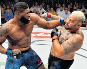  ?? Picture / Getty Images ?? Curtis Blaydes (left) beat Mark Hunt in Perth yesterday.