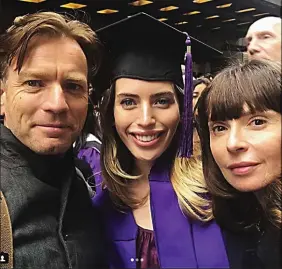  ??  ?? Graduation: McGregor with daughter Clara and wife Eve