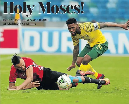  ?? Picture: Veli Nhlapo ?? Thulani Hlatshwayo vies for the ball with Anias Sabbouof of Libya during yesterday’s Afcon qualifier at Moses Mabhida Stadium in Durban.