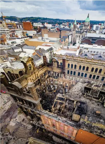  ??  ?? Most of the interior of the landmark Bank Buildings, which housed the Primark shop, in Belfast has collapsed after the blaze on Tuesday. Photo: Kevin Scott