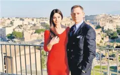  ??  ?? Monica Bellucci and Daniel Craig pose during a photocall to promote the 24th James Bond film.