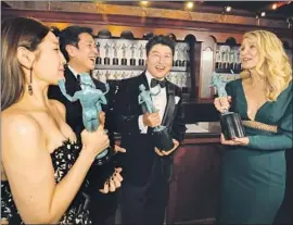  ??  ?? PARK SO DAM, left, Lee Sun Kyun and Song Kang Ho meet Laura Dern.