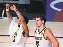  ?? Douglas P. DeFelice / Getty Images ?? Jamal Murray (left) scored 40 points and Nikola Jokic put together a tripledoub­le in Denver’s win over the Clippers.