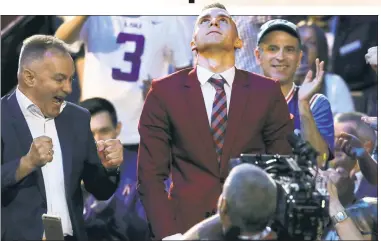  ?? Getty Images (2) ?? BIG MOMENT: Dzanan Musa, of Bosnia and Herzegovin­a, reacts after being selected by the Nets with the 29th pick of the first round in Thursday’s NBA draft.