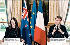  ?? YOAN VALAT/GETTY-AFP ?? New Zealand’s Prime Minister Jacinda Ardern, left, and French President Emmanuel Macron address the media Wednesday at the Elysee Palace in Paris.