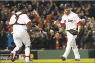  ?? David J. Phillip / Associated Press ?? Craig Kimbrel celebrates with Christian Vazquez after recording the final out of Game 2 of the World Series.