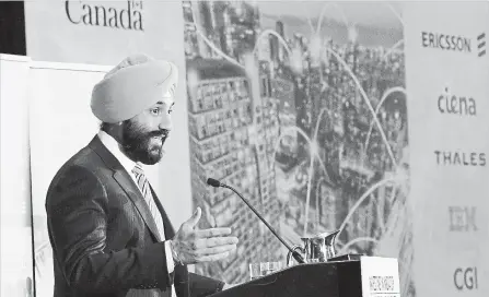  ?? JUSTIN TANG THE CANADIAN PRESS ?? Minister of Innovation, Science and Economic Developmen­t Navdeep Bains speaks during an announceme­nt on investment­s in 5G technology .