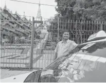  ?? REUTERS ?? Taxi driver Ko Naing poses in front of Shwedagon Pagoda in Yangon, Myanmar.