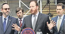  ??  ?? DO SOMETHING! Councilman David Greenfield (center), with (from left) state Sen. Simcha Felder and Councilmen Stephen Levin and Mark Levine Thursday, calls on Mayor de Blasio to respond to a jump in anti-Semitic crime.