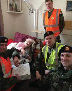  ??  ?? Maura Doyle celebrates her 100th birthday with members of the Defence Forces.