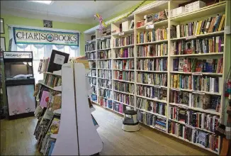  ?? ALYSSA POINTER/ALYSSA.POINTER@AJC.COM ?? Books line the shelves at Charis Books and More in Atlanta’s Little Five Points. The independen­t bookstore sells new and used books in a variety of topics.