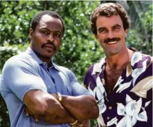  ?? CBS Photo Archive / Getty Images ?? Roger E. Mosley (left) and Tom Selleck starred in the hit crime drama series “Magnum, P.I.,” which ran from 1980 to 1988.