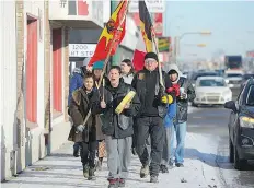  ?? BRANDON HARDER ?? Activists march down Albert Street on Friday protesting the verdict in the Tina Fontaine case in Winnipeg. On Thursday, a jury found Raymond Cormier not guilty in the death of the 15-year-old.