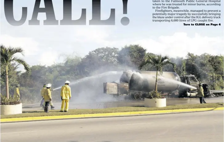 ?? (Photo: Philp Lemonte) ?? Firefighte­rs cool down the IGL truck transporti­ng liquid petroleum gas, which caught fire on the Rose Hall Main Road in St James, yesterday.