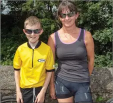  ??  ?? Seán O’Leary with his mom Catriona, Kilmichael get ready for the cycle run at the Liz Lucey Memorial Run in Inchgeela