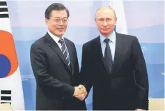  ??  ?? Putin (right) and Moon shake hands during a meeting at the Eastern Economic Forum in Vladivosto­k, Russia. — Reuters photo