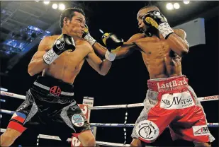  ?? Picture: GETTY IMAGES ?? ON THE BUTTON: Zolani Tete gets through Arthur Villanueva’s defences in a final eliminator for the WBO World bantamweig­ht championsh­ip in Leicester in April this year