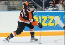  ?? NEWS PHOTO RYAN McCRACKEN ?? Medicine Hat Tigers defenceman David Quennevill­e fires a shot on goal during Saturday’s Western Hockey League home opener against the Lethbridge Hurricanes at the Canalta Centre