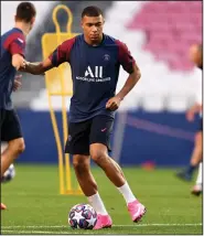  ?? (AP/David Ramos) ?? Kylian Mbappe of Paris Saint-Germain practices with a ball during a training session at the Luz stadium in Lisbon on Saturday. Paris Saint-Germain will play Bayern Munich in the Champions League final soccer match today.