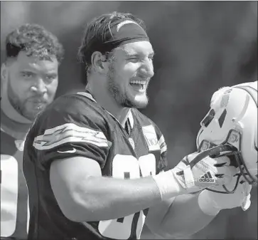  ?? Jae C. Hong Associated Press ?? JOEY BOSA LOOKED pretty happy during training camp, and after recovering from a foot injury, the Chargers’ defensive end might play for the first time Sunday against the Broncos.