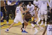  ?? JOSE CARLOS FAJARDO — BAY AREA NEWS GROUP, FILE ?? Former Warrior Zaza Pachulia (27) and Stephen Curry (30) guard the Cavaliers’ Kyrie Irving (2) during Game 1 of the 2017 NBA Finals at Oracle Arena in Oakland.