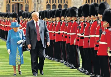  ??  ?? The Queen and President Trump inspect a Guard of Honour, formed of the Coldstream Guards, at Windsor Castle yesterday