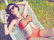  ??  ?? Evelyn Sharma prefers a twopiece bikini as long as it’s a perfect fit on her curvaceous body, and pops in happy colours