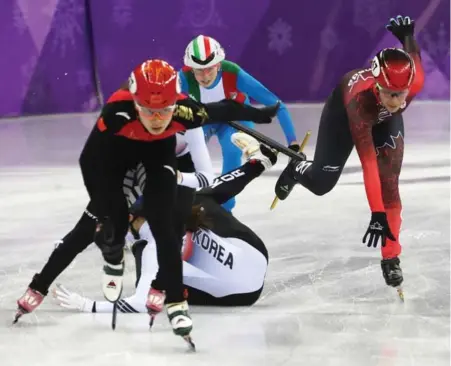  ?? STEVE RUSSELL/TORONTO STAR ?? Canadian speedskate­r Valerie Maltais, right, clips skates with fallen South Korean Alang Kim in Tuesday’s relay final, starting a chain reaction. In the end, the Canadians hoped DQs would leave them with a medal. No such luck.