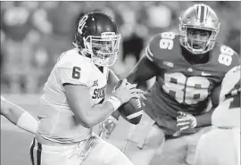  ?? Gregory Shamus Getty Images ?? BAKER MAYFIELD of Oklahoma runs downfield during the first half of a 31-16 victory over Ohio State on Saturday. Mayfield passed for 386 yards.