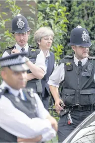  ??  ?? ALOOF PM May visits the scene on Friday. Pic: Phil Harris