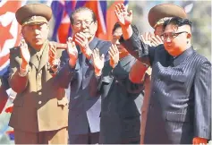  ??  ?? Kim waves to people cheering during an opening ceremony of a newly constructe­d residentia­l complex in Ryomyong street in Pyongyang, North Korea. — Reuters photo