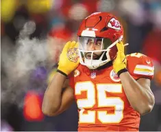  ?? REED HOFFMANN / ASSOCIATED PRESS ?? Kansas City Chiefs running back Clyde Edwards-Helaire adjusts his helmet during a Jan. 13 playoff game against the Miami Dolphins in Kansas City, Mo.