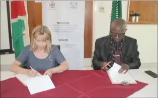  ?? Photo: Josephina Mwashindan­ge ?? Agreed… Councillor Mona Stormoen from Innlandet County Council and Samuel Shivute, chairperso­n of the Oshikoto Regional Council, signing a memorandum of understand­ing at the Okashana Centre.