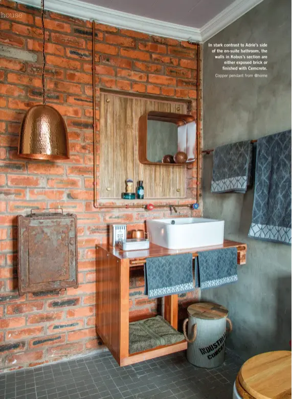  ??  ?? In stark contrast to Adrie’s side of the en-suite bathroom, the walls in Kobus’s section are either exposed brick or finished with Cemcrete. Copper pendant from @home