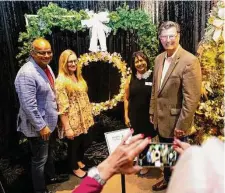  ?? ?? Sugar Land District 2 Representa­tive Naushad Kermally, from left, Vivien Garcia, Kalika Sinha and Mayor Joe Zimmerman attend a fundraiser Nov. 11 at the Houston Museum of Natural Science at Sugar Land.