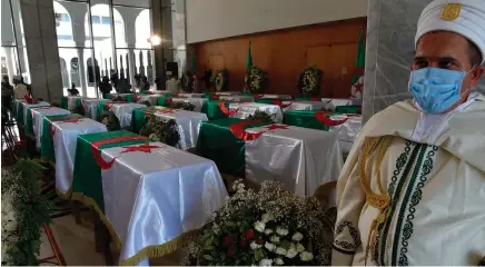  ?? Photo: Nampa/AFP ?? Painful past… National flag-draped coffins containing the remains of 24 Algerian resistance fighters presented at the capital’s Palais De La Culture Moufdi Zakaria.