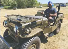  ??  ?? Sukh Riar pilots the 1953 Willys CJ3B Jeep that he restored in his home.