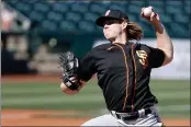  ?? CHRISTIAN PETERSEN — GETTY IMAGES, FILE ?? Giants reliever Caleb Baragar pitches during the second inning of a spring game against the Rangers on March 1in Surprise, Arizona.