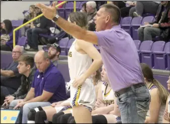  ?? Photos by Gerren Smith ?? Coach Mickey Shaffer instructin­g the Lady Indians during game action.