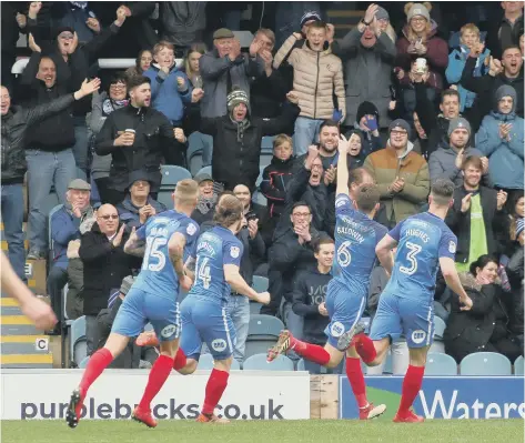  ??  ?? Jack Baldwin celebrates his goal against Northampto­n in front of the Posh fans.