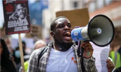  ??  ?? ‘In the wake of George Floyd’s death came a remarkable change of atmosphere, even on the distant island of Great Britain.’ A Black Lives Matter protest, London, 21 June 2020. Photograph: Leon Neal/Getty Images