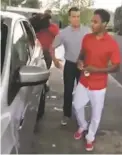  ?? IMAGE FROM WASHINGTON POST VIDEO ?? Bellhops chief executive Luke Marklin, left, gave employee Walter Carr his own car, a 2014 Ford Escape, after hearing about how he walked 20 miles to get to the first day on his new job.