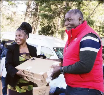  ??  ?? Informatio­n Communicat­ion Technology and Cyber Security Minister Supa Mandiwanzi­ra hands over laptops to Nyamhuka Primary School head Ms Cecilia Makanyanga during a Potraz road show in Nyanga on Saturday.