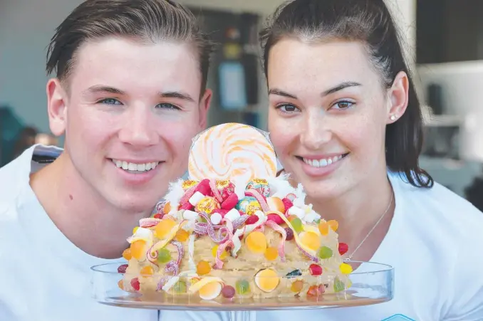  ?? Picture: GLENN HAMPSON ?? Zac McFarlane and Caitlynn Henry, who have a cookie dough business called Just Dough It, are about to launch a home delivery service of cookie dough cakes.