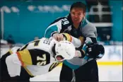  ?? ANDA CHU — BAY AREA NEWS GROUP ?? The Sharks’ Kurtis Gabriel, right, and Vegas Golden Knights’ Ryan Reaves drop the gloves during a game last week.