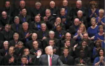  ?? CAROLYN KASTER — THE ASSOCIATED PRESS ?? Members of the First Baptist Dallas Church Choir are seated behind President Donald Trump as he speaks during the Celebrate Freedom event at the Kennedy Center for the Performing Arts in Washington, Saturday.