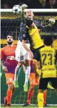  ??  ?? APOEL goalkeeper Nauzet Perez and Dortmund midfielder Julian Weigl vie for the ball during yesterday’s Champions League Group H match in Dortmund. –