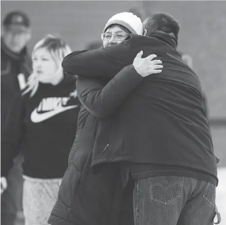  ?? PHOTOS: LIAM RICHARDS ?? La Loche Mayor Robert St. Pierre hugs MP Georgina Jolibois on Friday outside La Loche provincial court, where a judge announced the young man responsibl­e for the 2016 school shootings would be sentenced as an adult. St. Pierre said he was ‘pleased with...