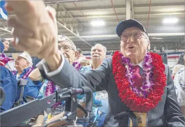  ?? Eugene Tanner Associated Press ?? DONALD STRATTON was one of four survivors from the battleship Arizona who attended the ceremony in Honolulu. Stratton recently wrote a book about his experience at Pearl Harbor titled “All the Gallant Men.”