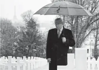  ?? Jacquelyn Martin / Associated Press ?? President Trump stands among headstones at Suresnes American Cemetery near Paris during a centennial American Commemorat­ion Ceremony, which marks the armistice ending World War I.